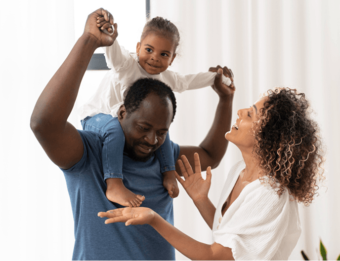 Happy family with child on shoulders